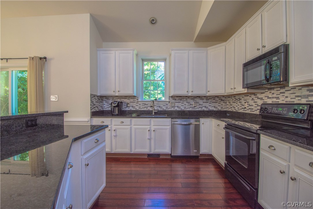 9330 Springmount Terrace Chesterfield, VA 23832 - Photo 12 of 38 a kitchen with granite countertop wooden floors appliances and sink