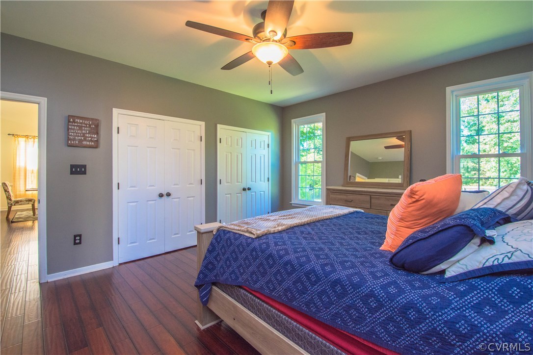 9330 Springmount Terrace Chesterfield, VA 23832 - Photo 20 of 38 a bedroom with a bed and a chandelier