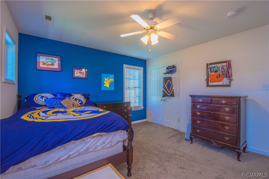 9330 Springmount Terrace Chesterfield, VA 23832 - Photo 31 of 38 a bedroom with a bed and a chandelier