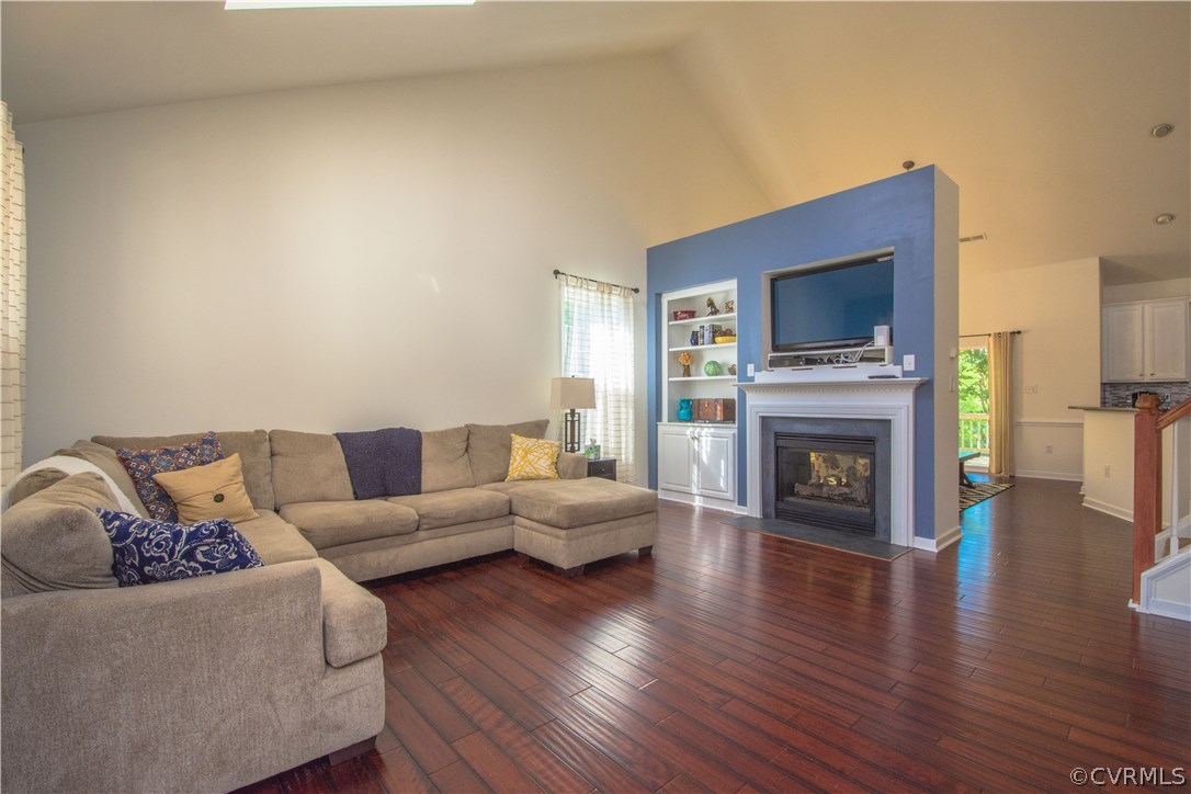 9330 Springmount Terrace Chesterfield, VA 23832 - Photo 6 of 38 a living room with furniture a fireplace and a flat screen tv