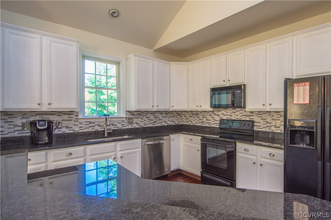 9330 Springmount Terrace Chesterfield, VA 23832 - Photo 9 of 38 a kitchen with stainless steel appliances granite countertop a sink stove and microwave