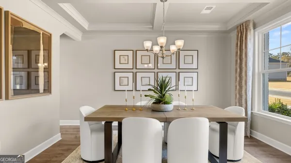 a kitchen with kitchen island granite countertop a sink cabinets and wooden floor
