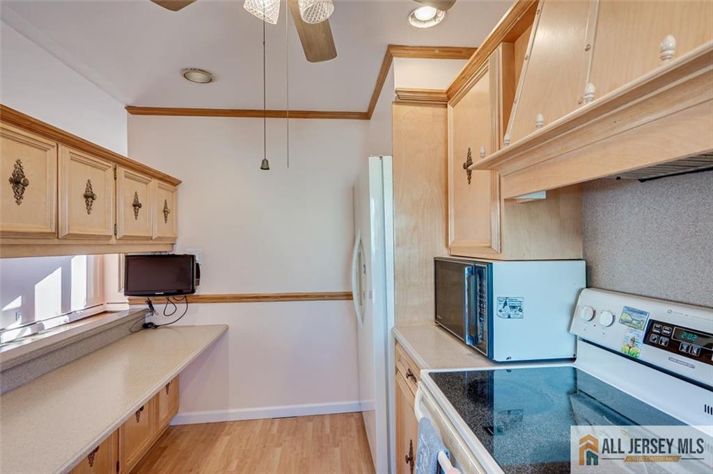 31 Marie Road Fords, NJ 08863 - Photo 15 of 44 a kitchen with stainless steel appliances a stove a sink and a refrigerator