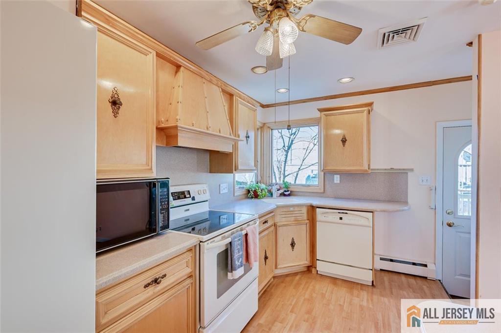 31 Marie Road Fords, NJ 08863 - Photo 16 of 44 a kitchen with a sink a counter space cabinets and appliances