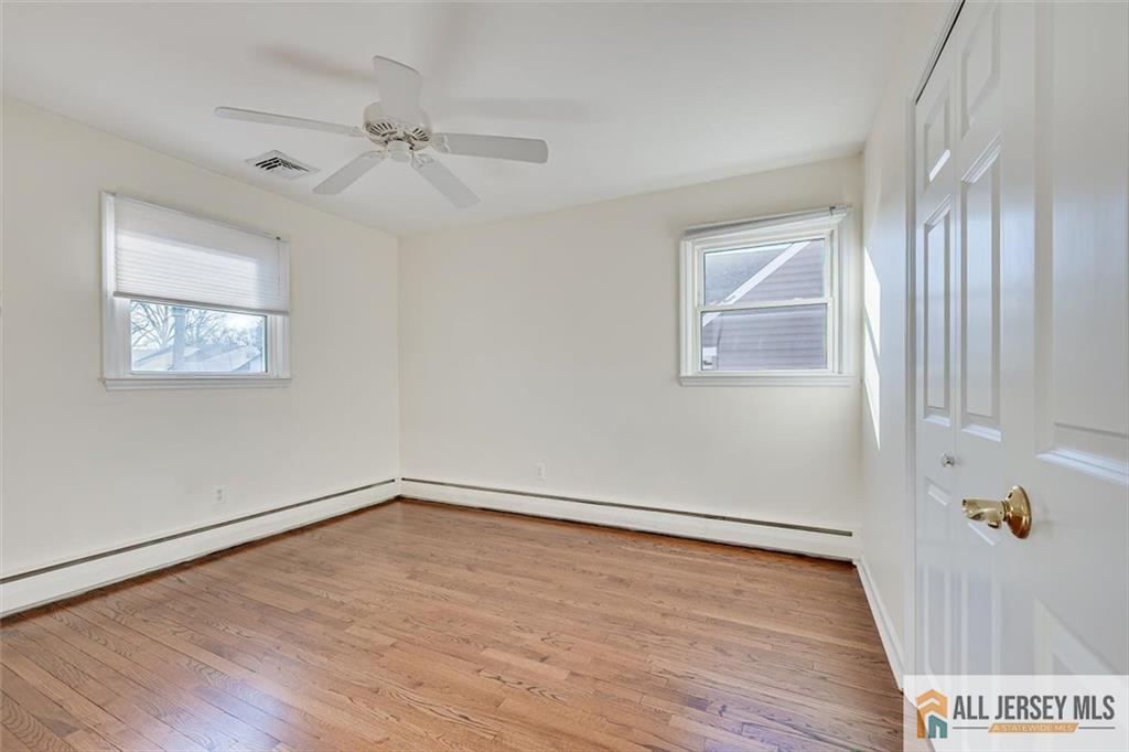 31 Marie Road Fords, NJ 08863 - Photo 21 of 44 wooden floor in an empty room with a window