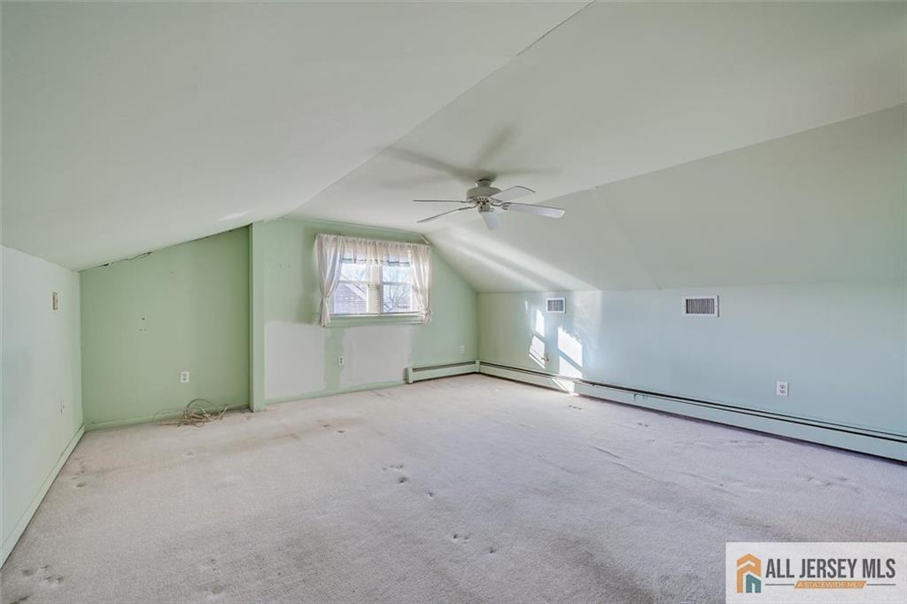 31 Marie Road Fords, NJ 08863 - Photo 27 of 44 an empty room with windows and fan