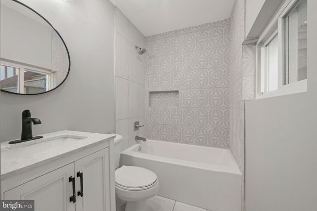 a view of a workspace room with furniture and wooden floor
