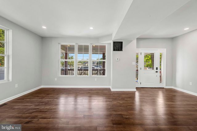 a view of an entryway with wooden floor