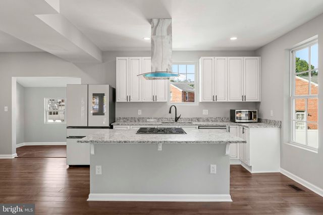 a view of hallway with wooden floor