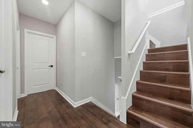 a view of bathroom with a toilet sink bath tub and shower