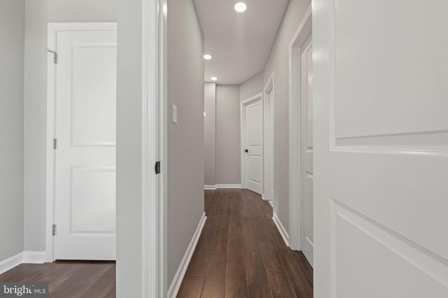 a view of room with wooden floor