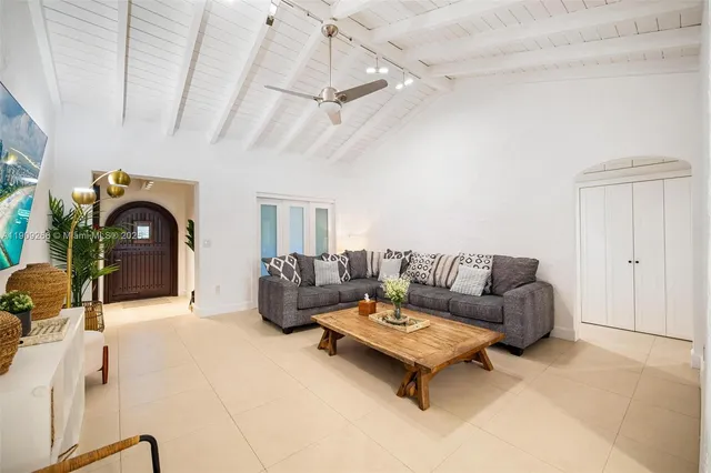 a kitchen with a table chairs stove and cabinets