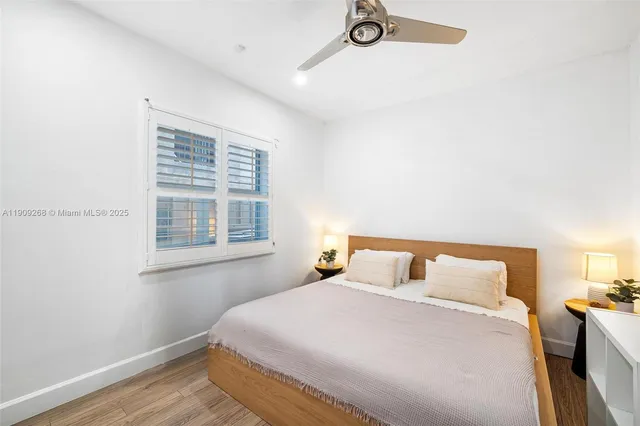 an aerial view of residential houses with outdoor space and swimming pool