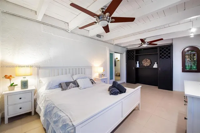 an aerial view of residential houses with outdoor space and lake view