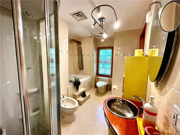 a kitchen with stainless steel appliances granite countertop a stove a sink dishwasher a microwave oven with granite countertops and cabinets
