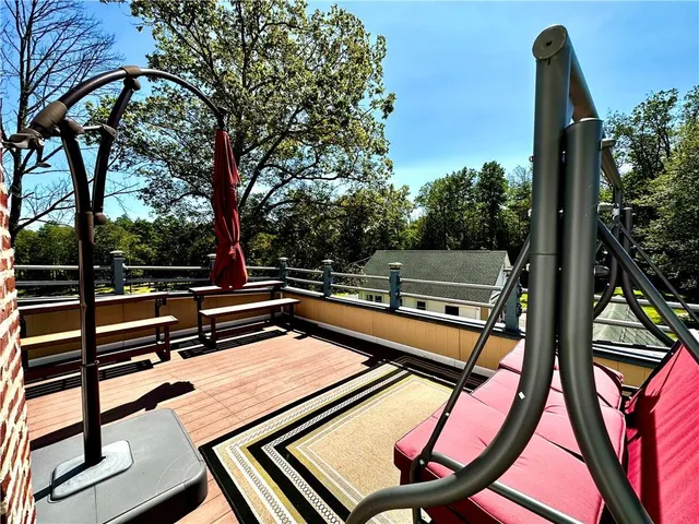 a view of yard with swimming pool and green space