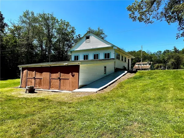 a view of backyard with swimming pool