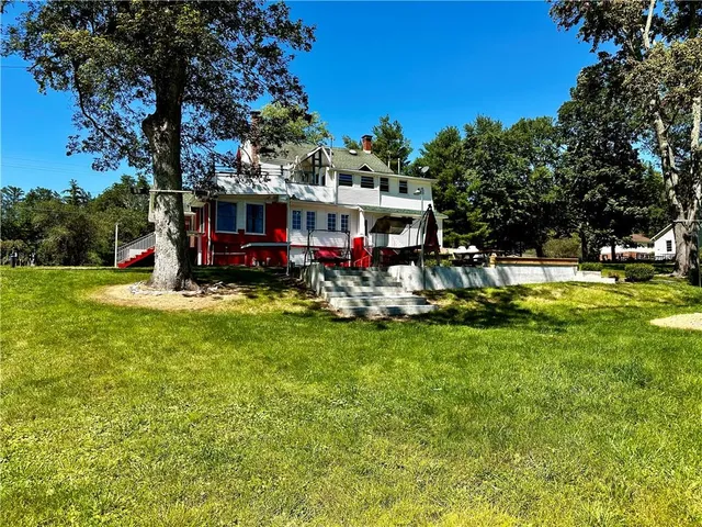 a view of a house with a big yard