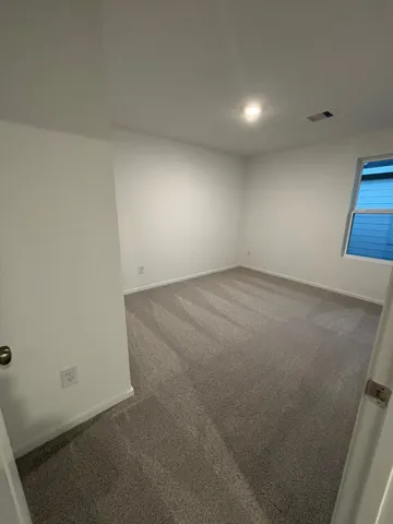 an empty room with a bench