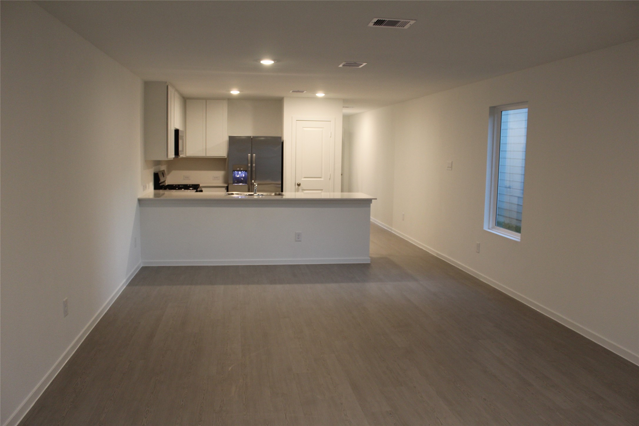 1733 Lofty Cedar Court Conroe, TX 77301 - Photo 2 of 18 a view of kitchen with kitchen island sink and center island