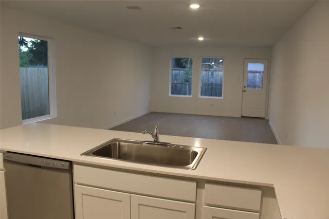 a kitchen with a sink and cabinets