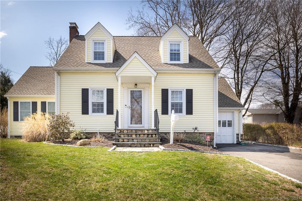 31 George Street Trumbull, CT 06611 - Photo 1 of 1 a front view of a house with garden