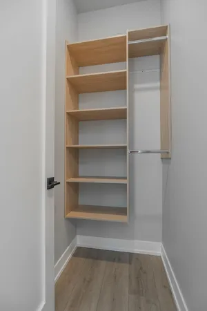 a view of a hallway with washer and dryer