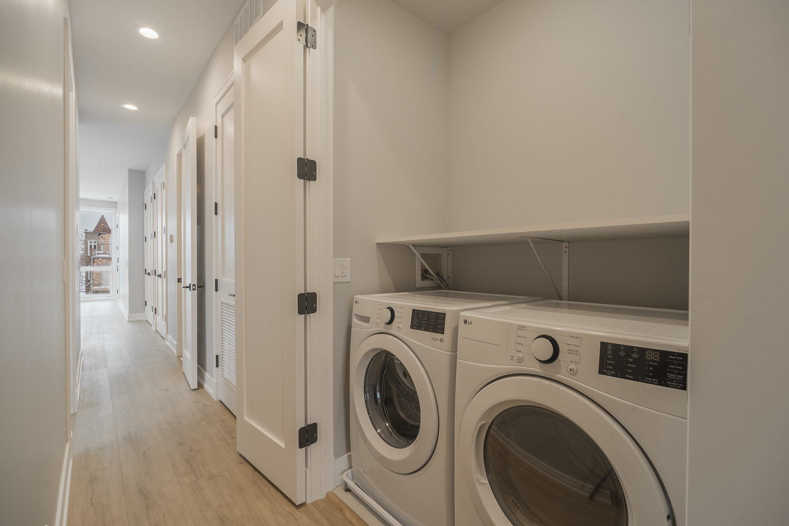3738 South Calumet Avenue, Unit 2N Chicago, IL 60653 - Photo 20 of 21 a view of a hallway with washer and dryer