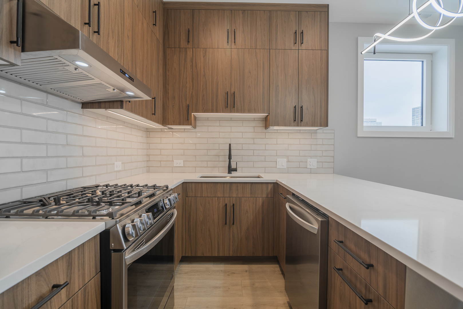 3738 South Calumet Avenue, Unit 2N Chicago, IL 60653 - Photo 7 of 21 a kitchen with a sink stove and cabinets
