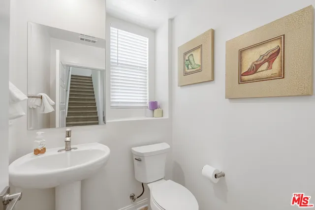 a work room with furniture and a potted plant