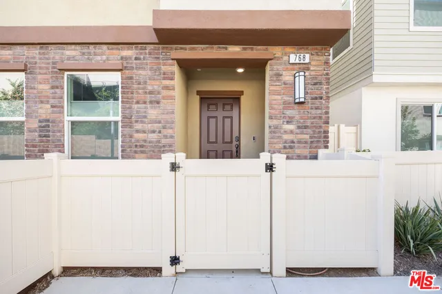 a bedroom with a bed and a lamp