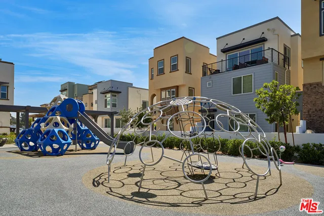 a front view of a building with retail shop and a fire pit