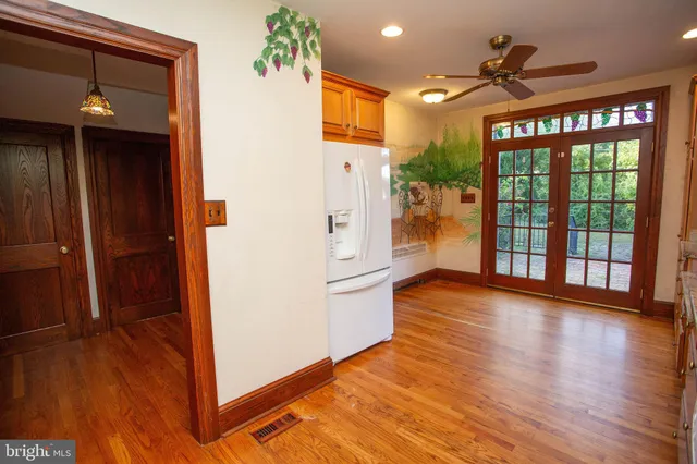 a view of an entryway with wooden floor
