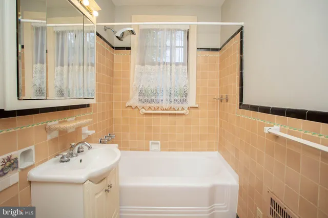 a bathroom with a sink and a bathtub