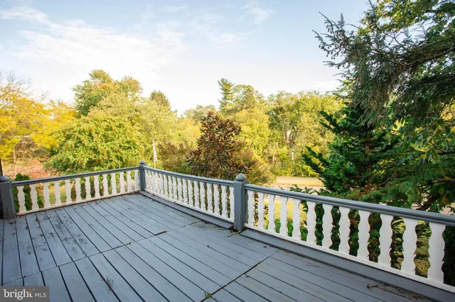 a view of balcony with wooden floor
