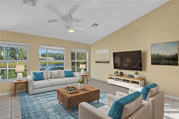 a living room with furniture and a flat screen tv