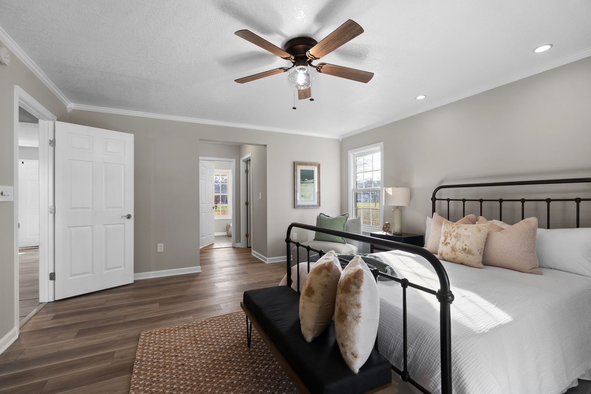 954 Newt Vanattia Road Hillsboro, TN 37342 - Photo 16 of 42 a bedroom with bed and a chandelier