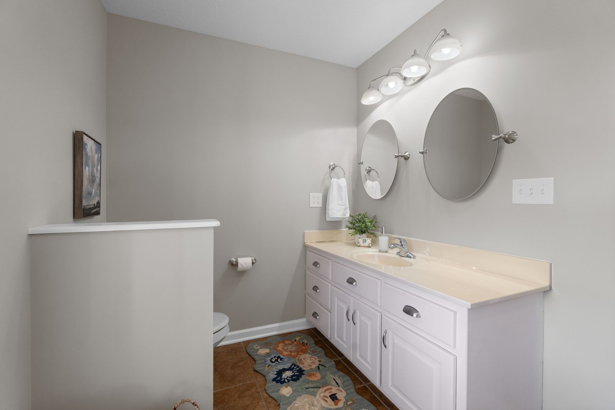 954 Newt Vanattia Road Hillsboro, TN 37342 - Photo 18 of 42 a bathroom with a double vanity sink and a mirror