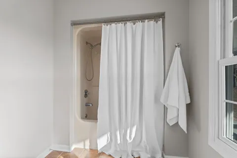 a close view of walk in closet with window