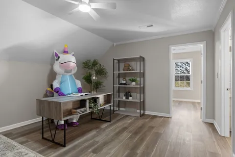 a room with furniture and wooden floor