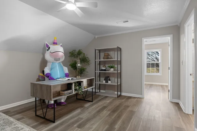 a room with furniture and wooden floor