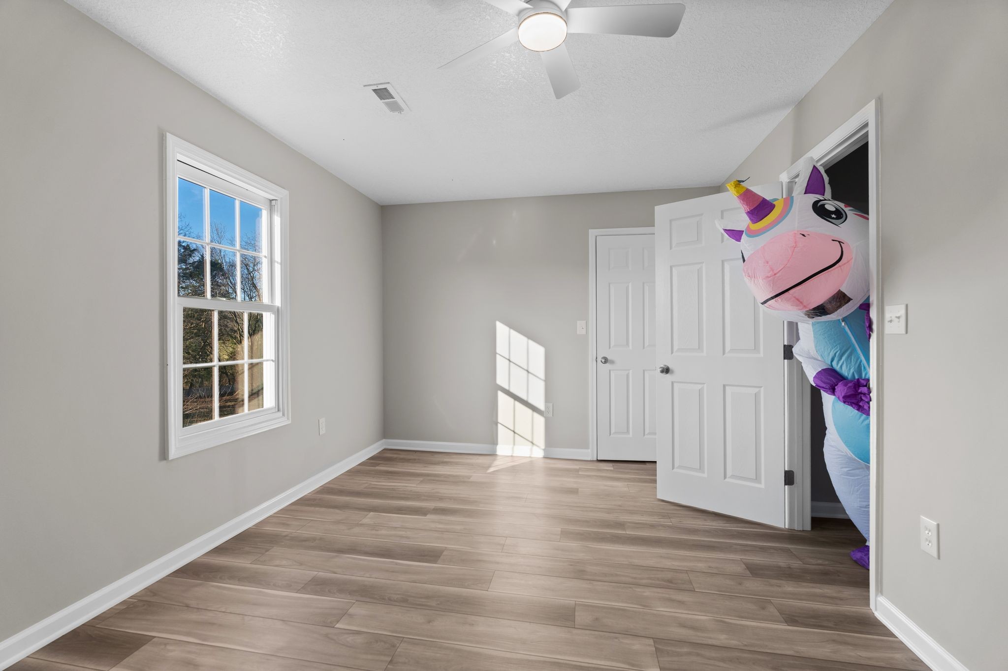 954 Newt Vanattia Road Hillsboro, TN 37342 - Photo 33 of 42 a view of an empty room with wooden floor and a window