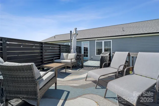 a outdoor living space with patio furniture and a potted plant