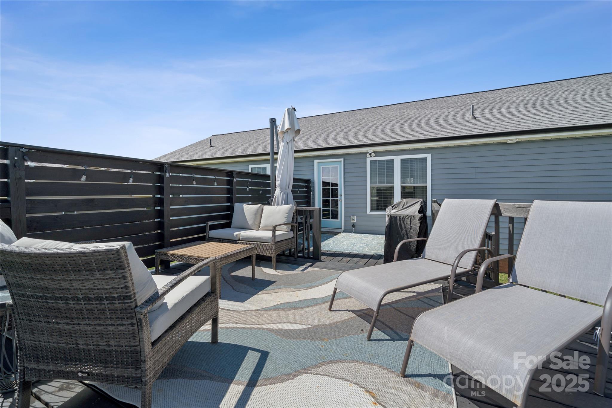 142 Alf Hoover Road Lincolnton, NC 28092 - Photo 35 of 40 a outdoor living space with patio furniture and a potted plant
