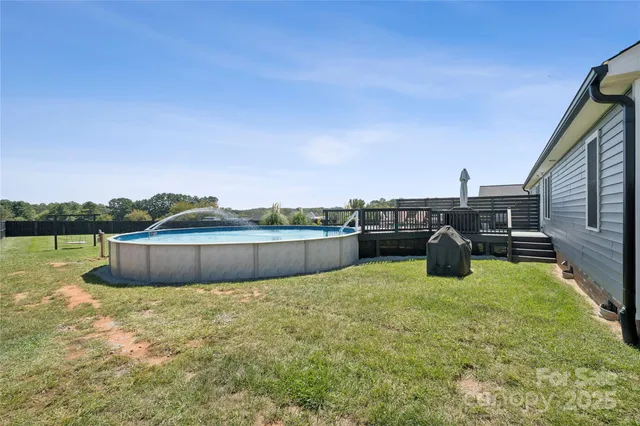 a view of a swimming pool with a chairs