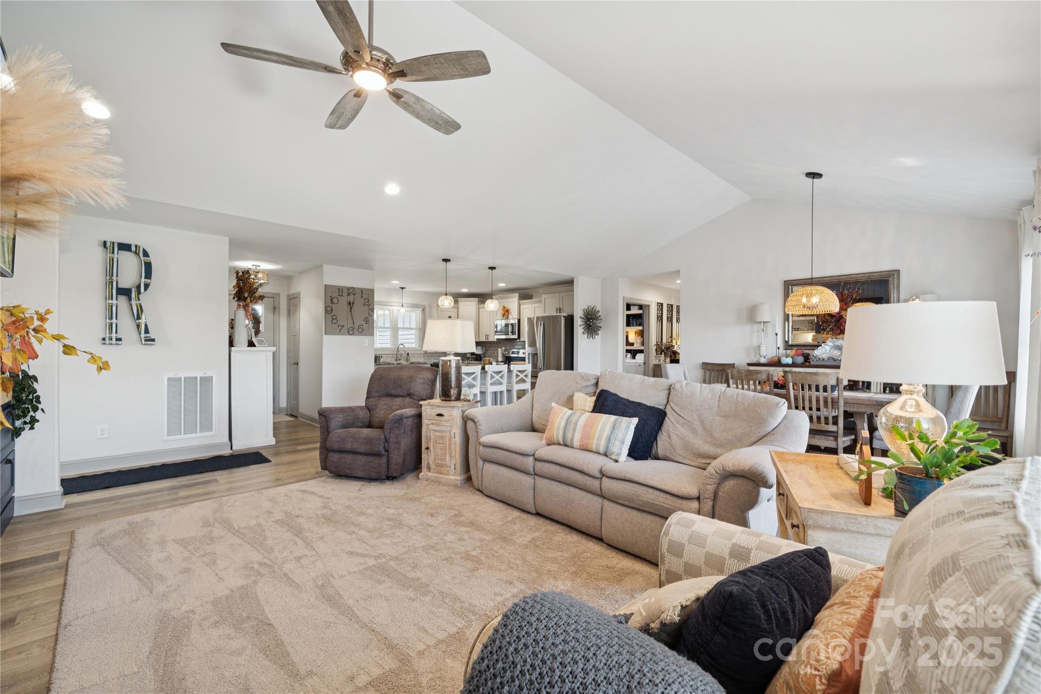 142 Alf Hoover Road Lincolnton, NC 28092 - Photo 6 of 40 a living room with furniture and a chandelier