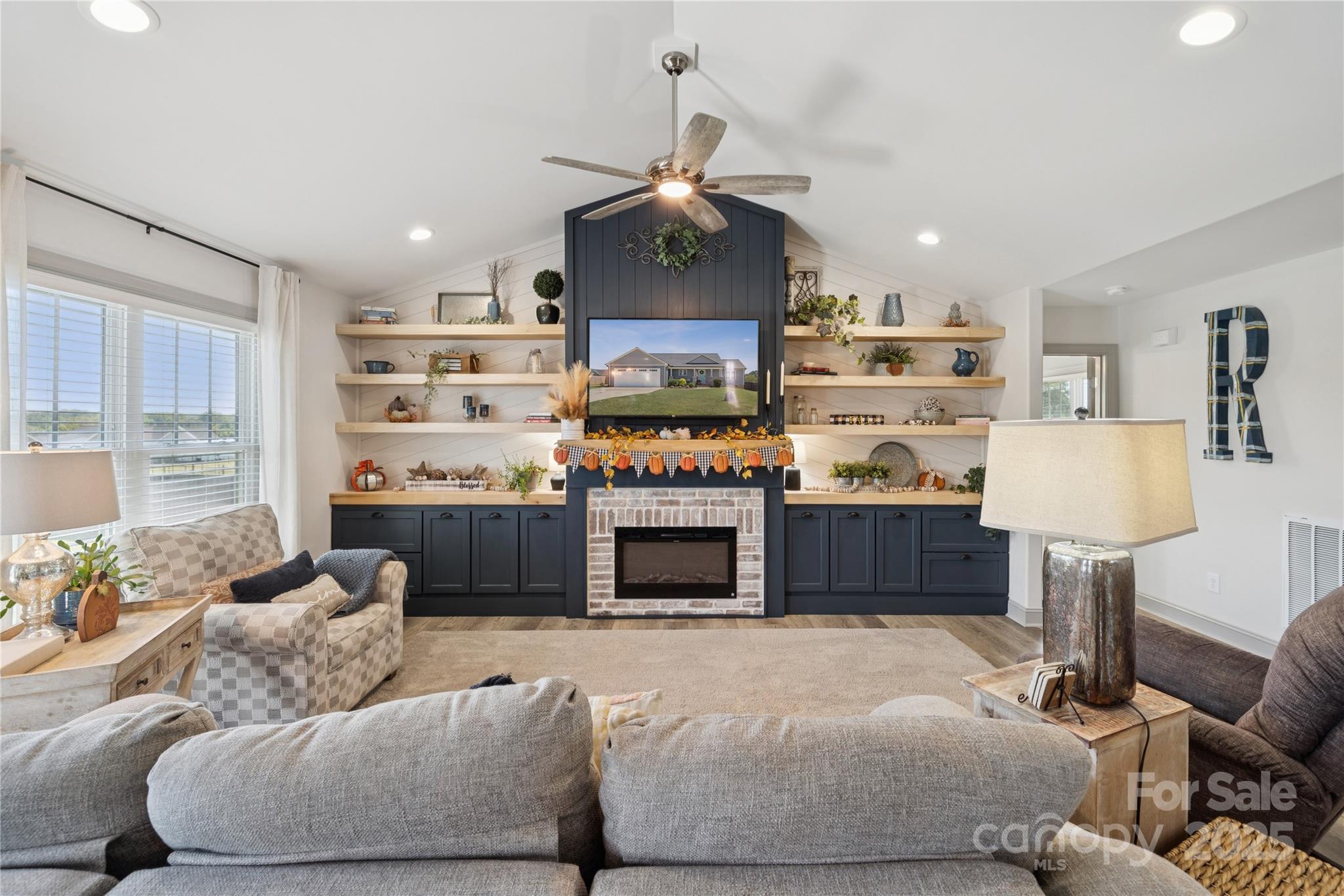142 Alf Hoover Road Lincolnton, NC 28092 - Photo 7 of 40 a living room with furniture and a fireplace