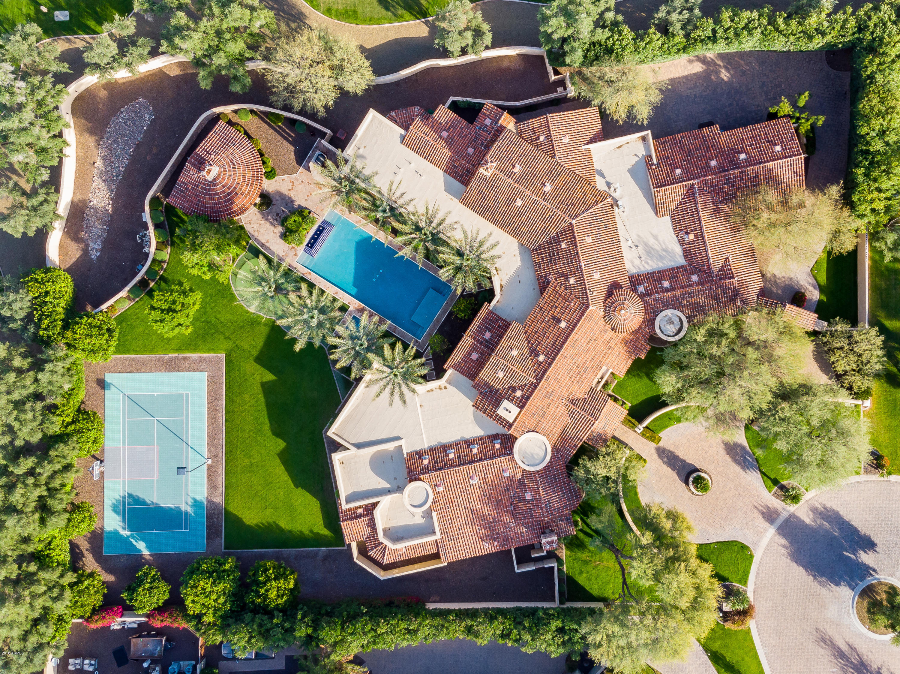 an aerial view of a house with outdoor space and street view