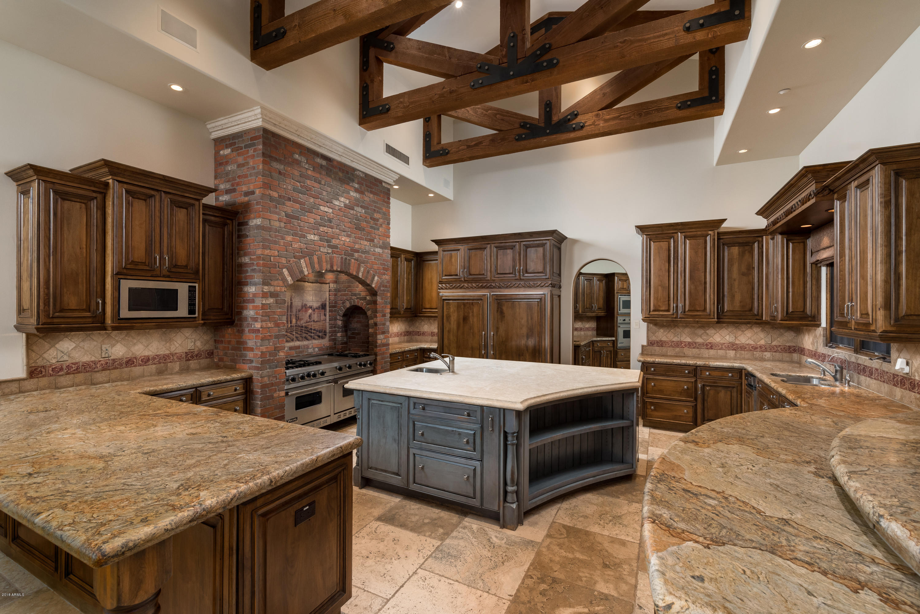 6390 East Royal Palm Road Paradise Valley, AZ 85253 - Photo 14 of 58 a kitchen with a stove a counter top space and stainless steel appliances