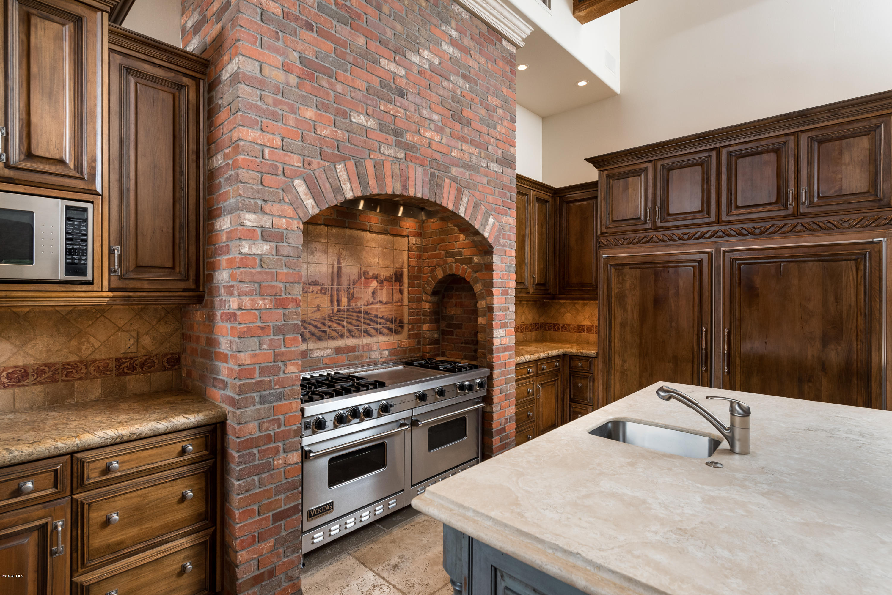 6390 East Royal Palm Road Paradise Valley, AZ 85253 - Photo 15 of 58 a kitchen with a stove and a refrigerator